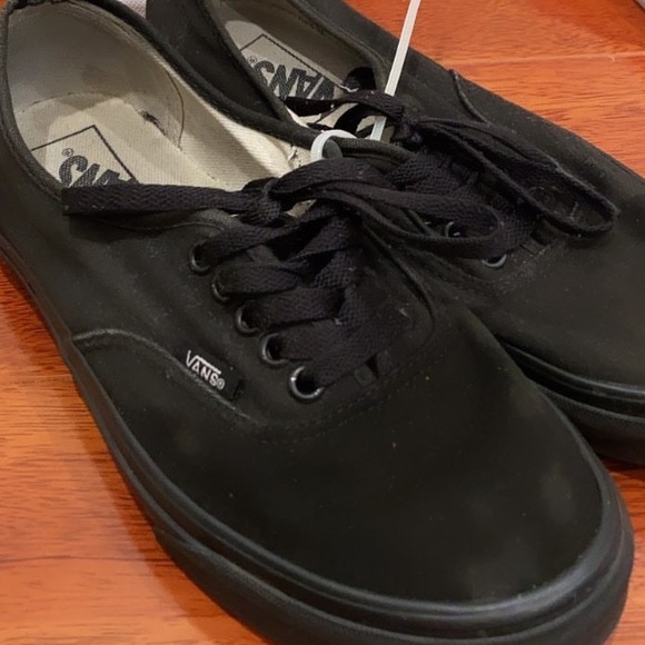 all black low top vans
